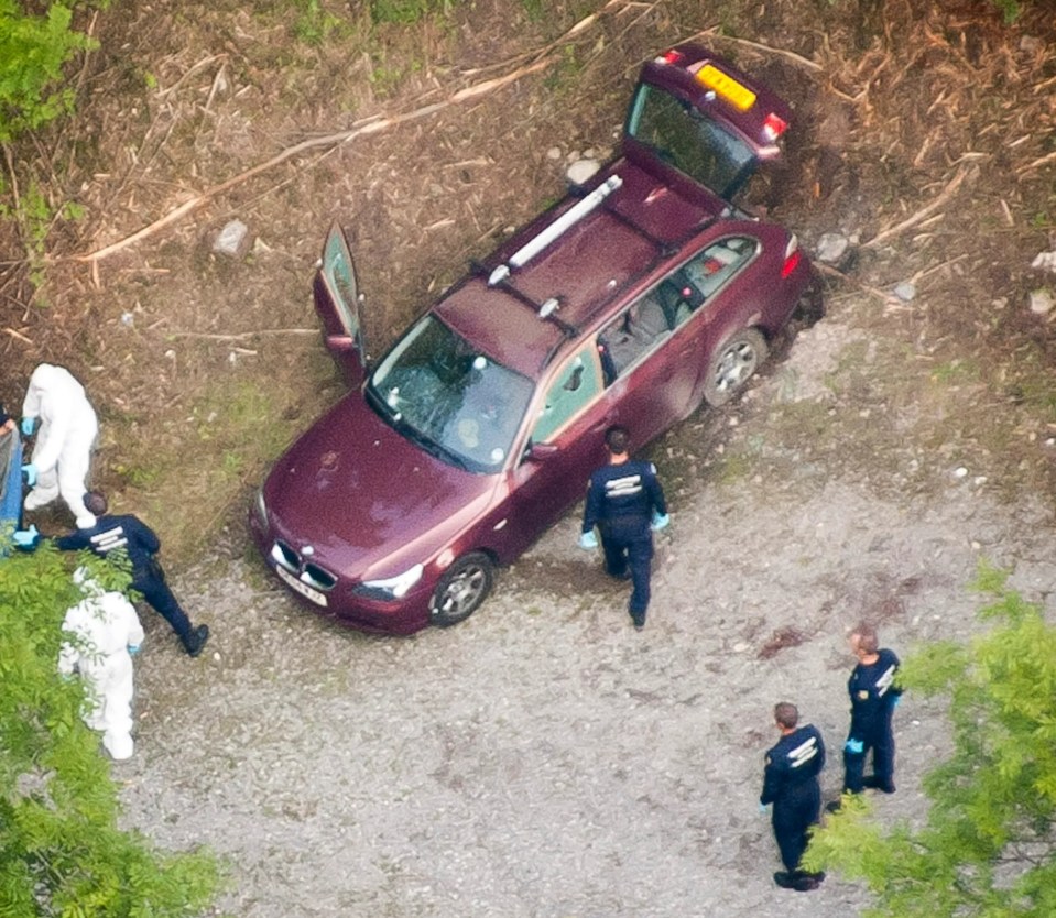 Cops and forensic workers at the crime scene in the French Alps