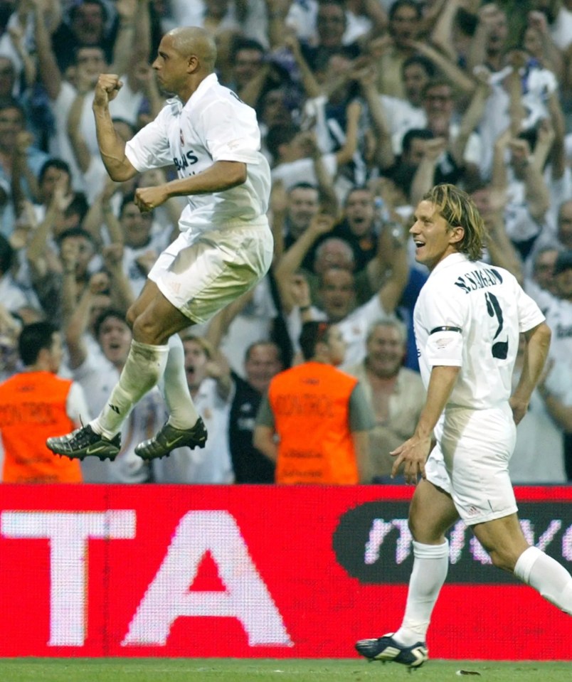 Roberto Carlos celebrates his goal alongside Real Madrid teammate Michel Salgado in 2003