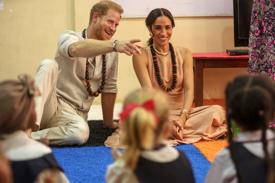 The Sussexes chatted away with children in a classroom at Lights Academy