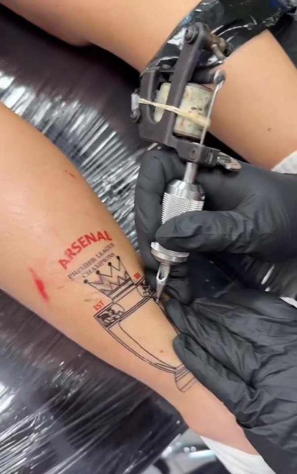 The apparent tattoo celebrated Arsenal winning the league