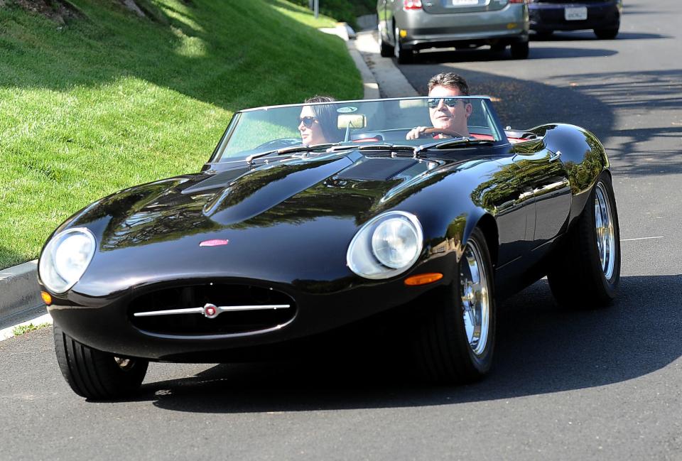 Cowell driving around Beverly Hills in his vintage Jaguar