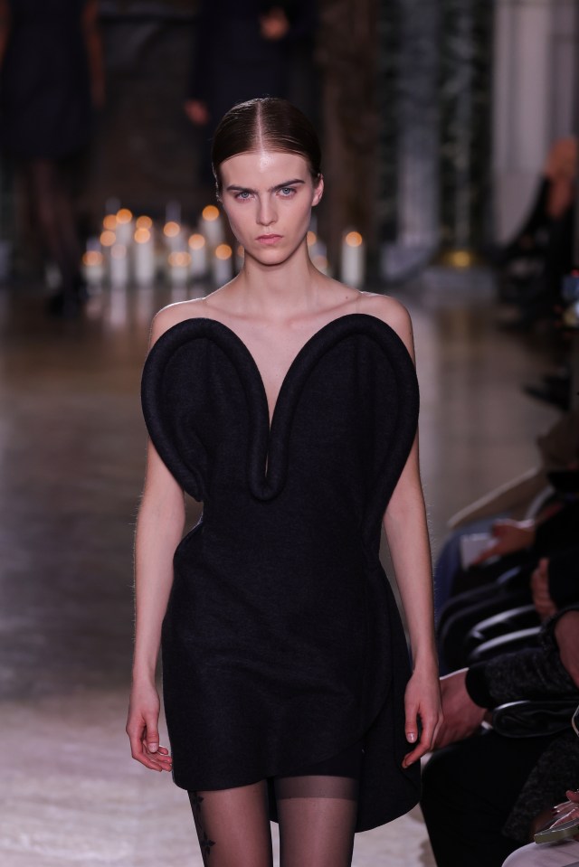 This black dress that Phoebe wore, shown at Paris Fashion Week, was also designed by Vic