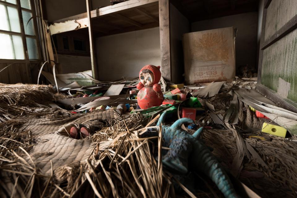 This image shows creepy detritus littering one of the abandoned buildings