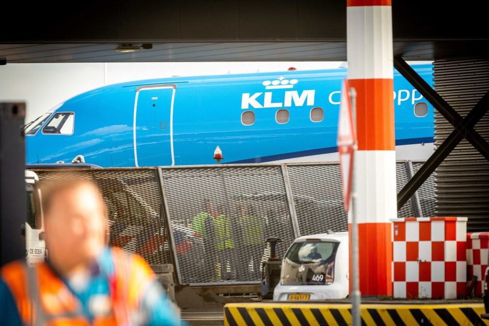 Emergency workers on the tarmac at Schiphol airport yesterday afternoon