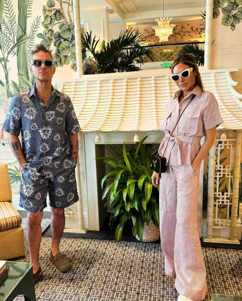 Robbie Williams has packed his bags and left the USA, pictured with partner Ayda Field