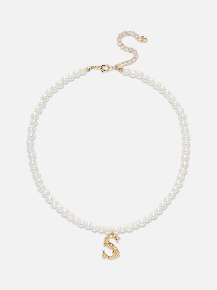 This necklace from Primark gives a regal feel with its pearl and initial detailing