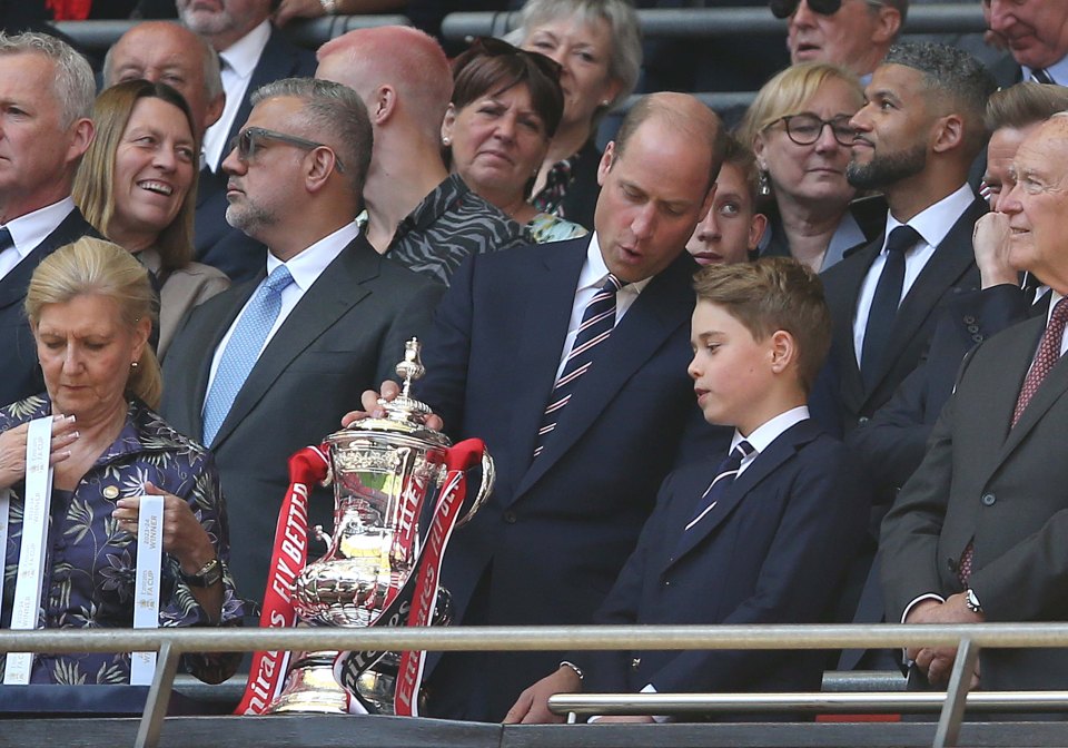 Wills seemed to be giving tips on the action to his son Prince George