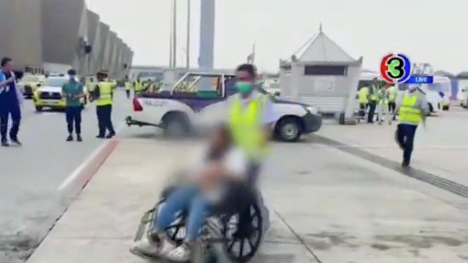 Passengers were helped off the plane in wheelchairs and on stretchers