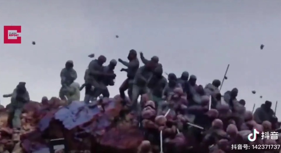 Footage showed the troops fighting with sticks and iron rods as bricks and stones were seen flying overhead