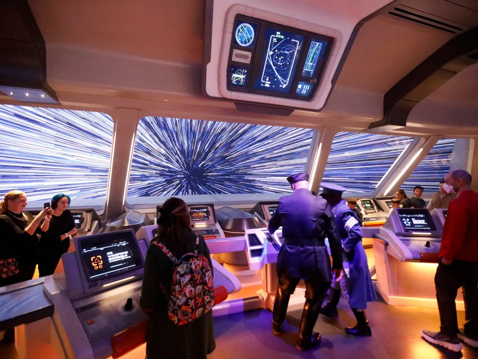 Actors playing Star Wars characters 'drive' the spaceship at the ship’s bridge as the first passengers experience the two-day trip