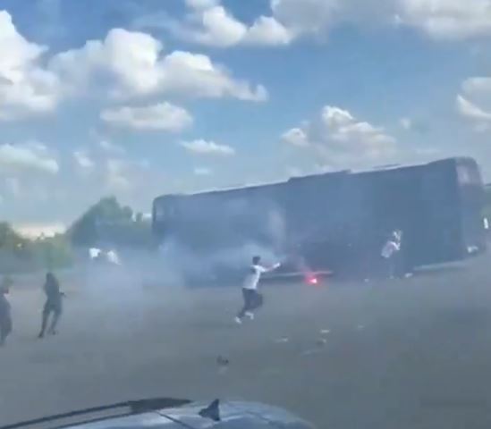 Coaches are surrounded by smoke in the alarming footage