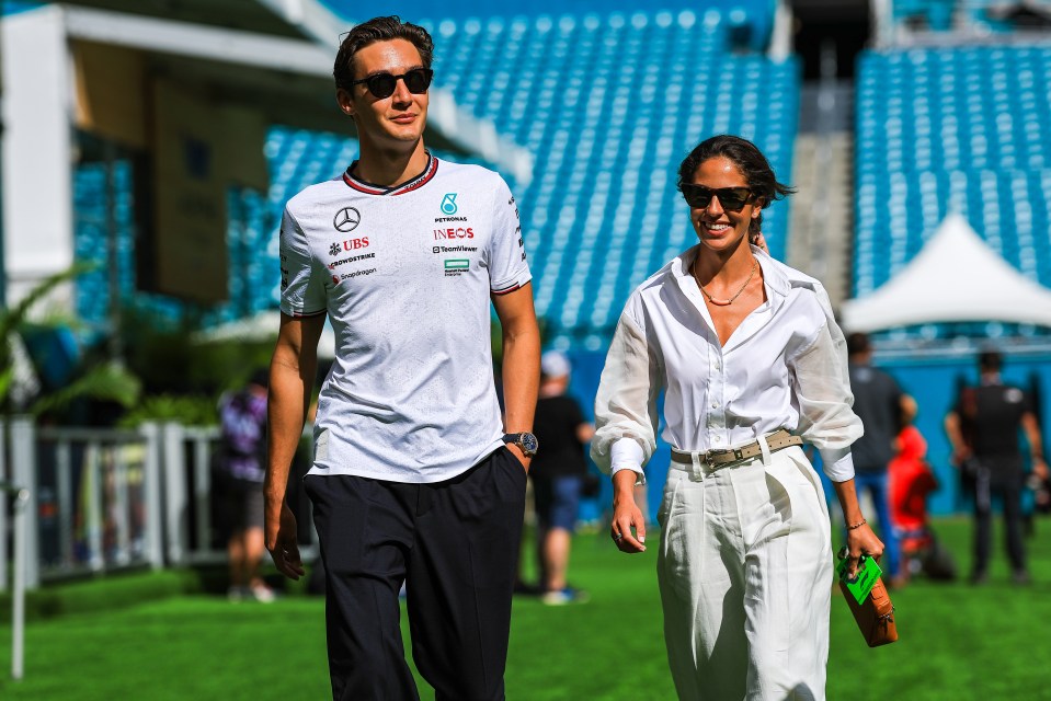 George Russell and Carmen Mundt were all smiles as they arrived at the track