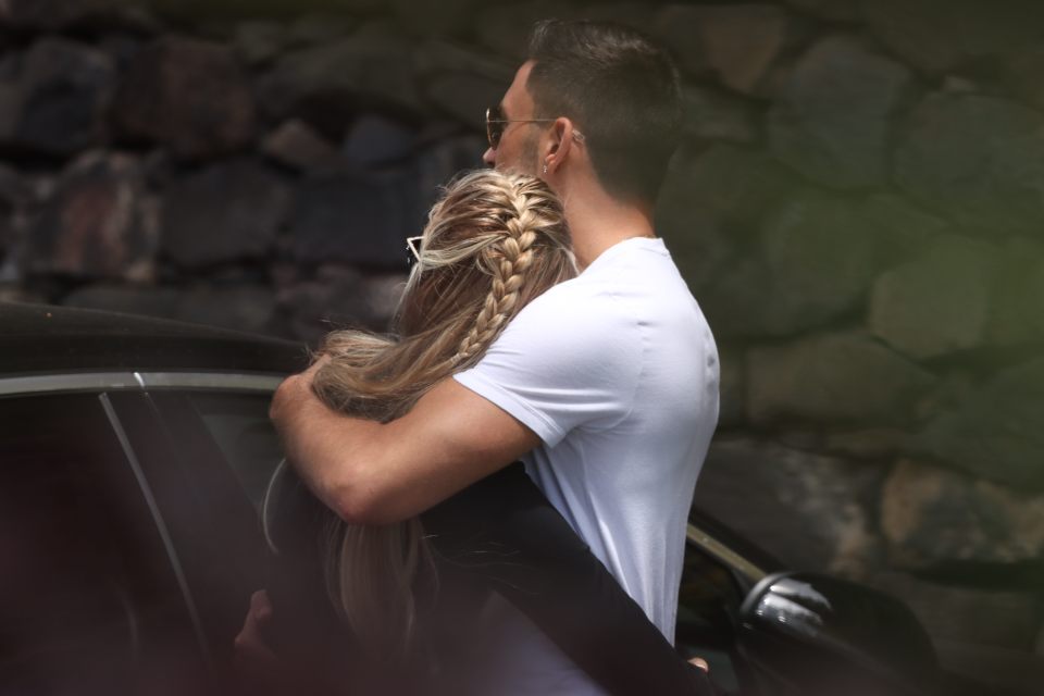 Gio and Molly hug on their sunny getaway