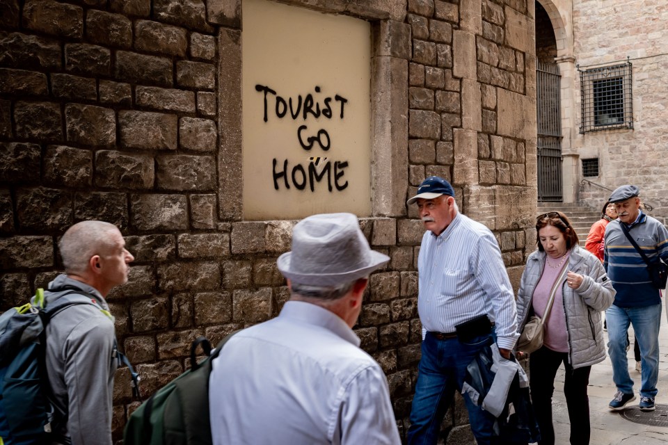 Grafitti reading "tourist go home" has appeared on a wall in Majorca