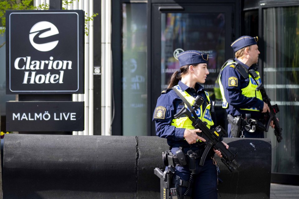 Police guard the hotel where the Dutch delegation is staying before tonight's final