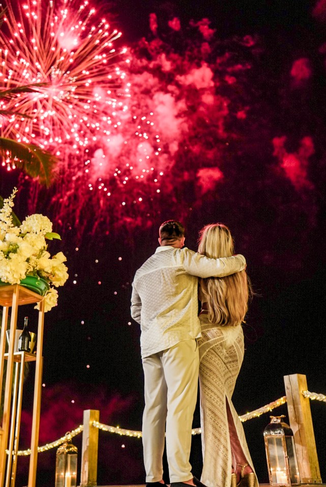 The newly-engaged couple watched a stunning fireworks display after the propsal