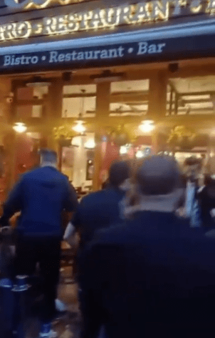 New video has revealed several people gathered in the outdoor seating area moments after the shooting