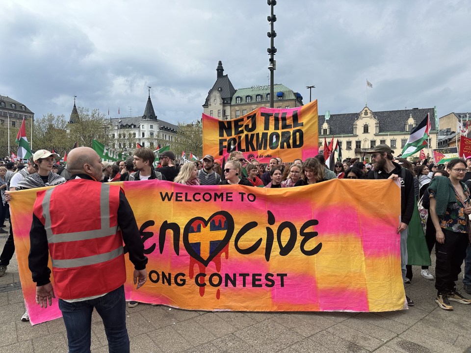 A banner with 'genocide' written in the Eurovision style