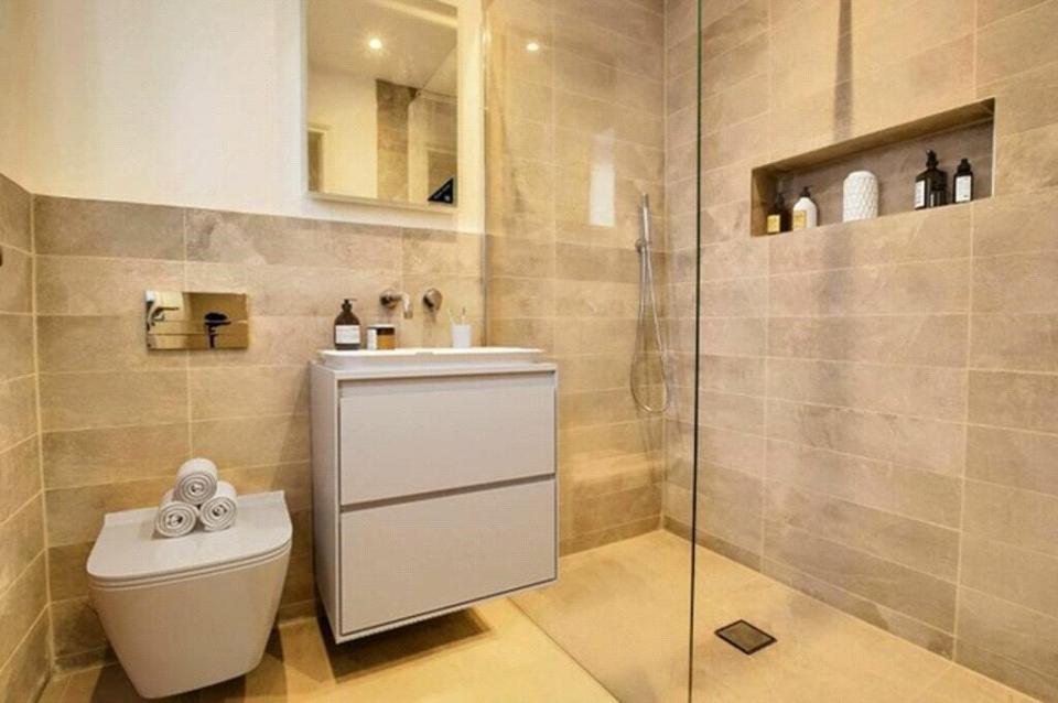 The bathroom is a modern wet room