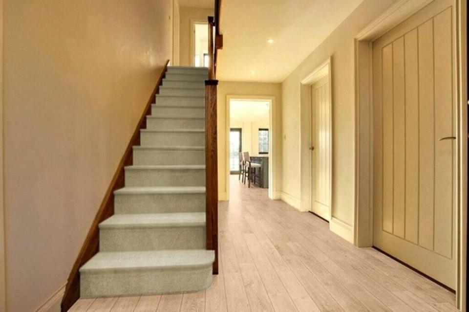 The new pad features a grand hallway and staircase