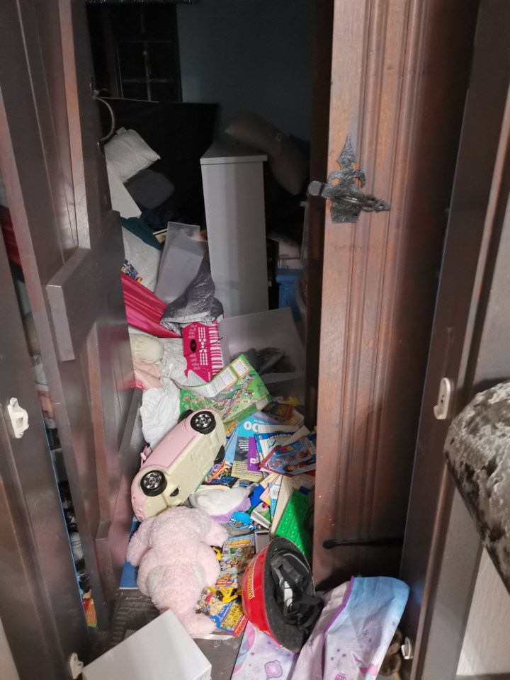 Piles of dirty clothes and litter crammed into rooms and cupboards