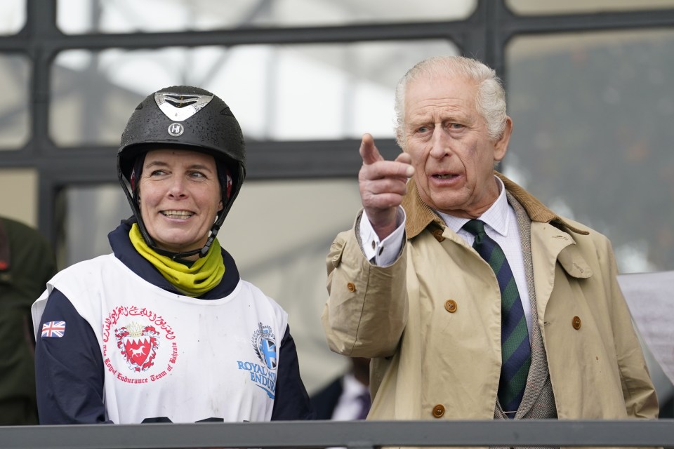 The monarch watched on from the track sidelines with riders