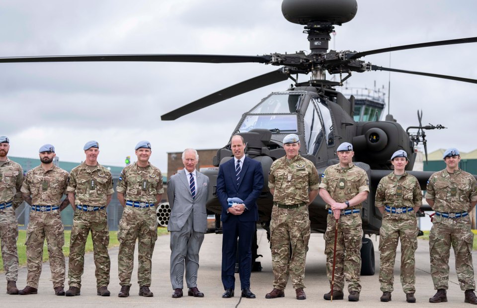 The father and son shared a touching moment in front of an Apache chopper