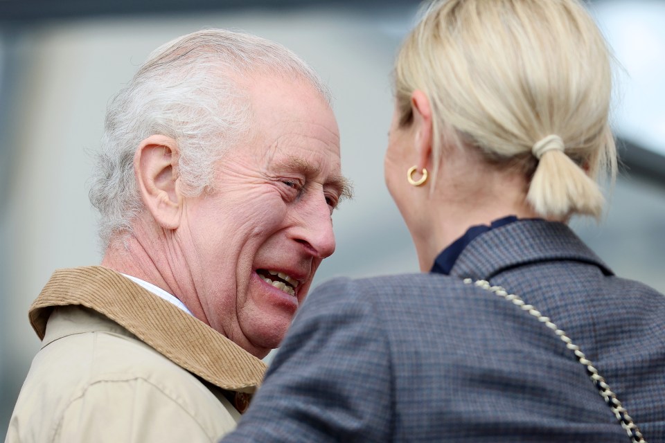 He smiled as he chatted with his niece Zara Tindall