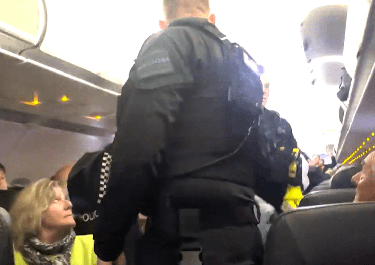 Cops escorted them off the plane