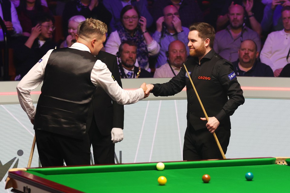 Wilson embraces with Jones during the Crucible final