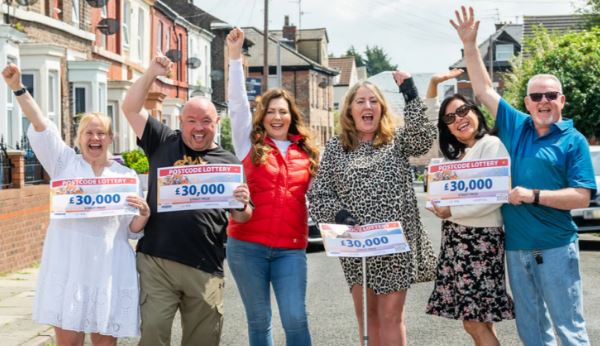 The Royal Mail worker and her husband won with five other neighbours