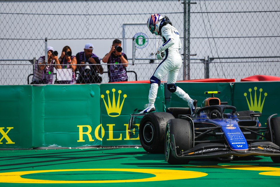 Williams driver Logan Sargeant exits the car after colliding with Magnussen during the Miami Grand Prix