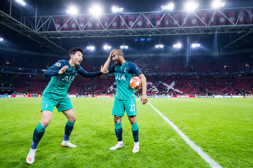 Son Heung-min celebrates with hat-trick hero Moura