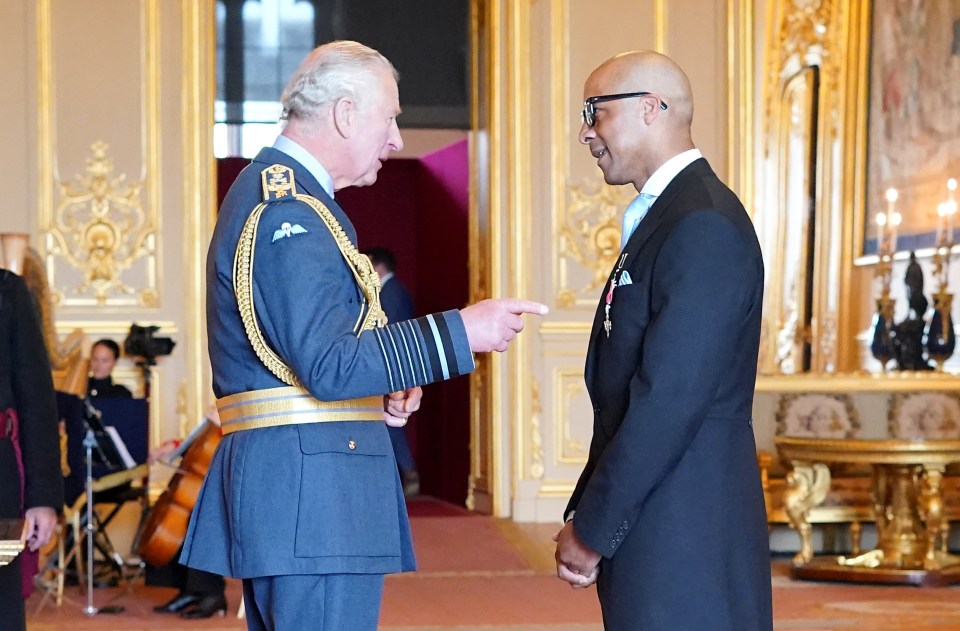 Charles handing Jay an MBE at Windsor Castle for ­services to craft