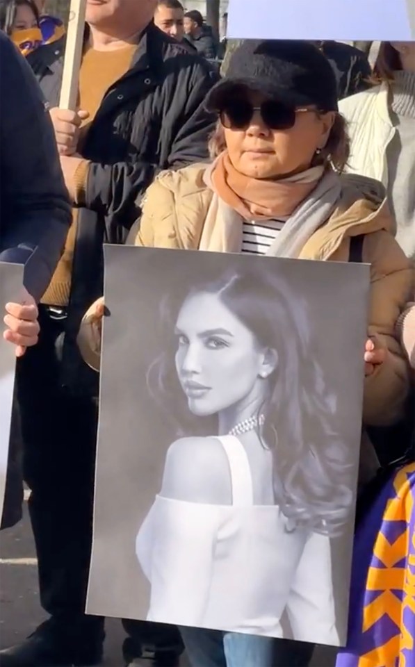 A woman pictured at a 'No to domestic violence' public rally in Kazakhstan in memory of murdered Nukenova