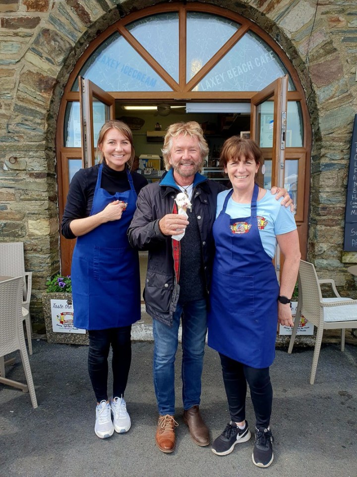 Noel Edmond tucked into a delicious ice cream at a seaside town - but fans were more interest in a bizarre detail they spotted