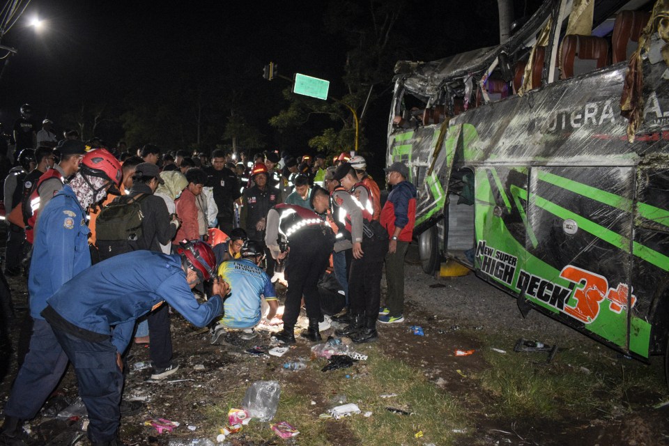 Officers were seen checking the debris and belongings of passengers