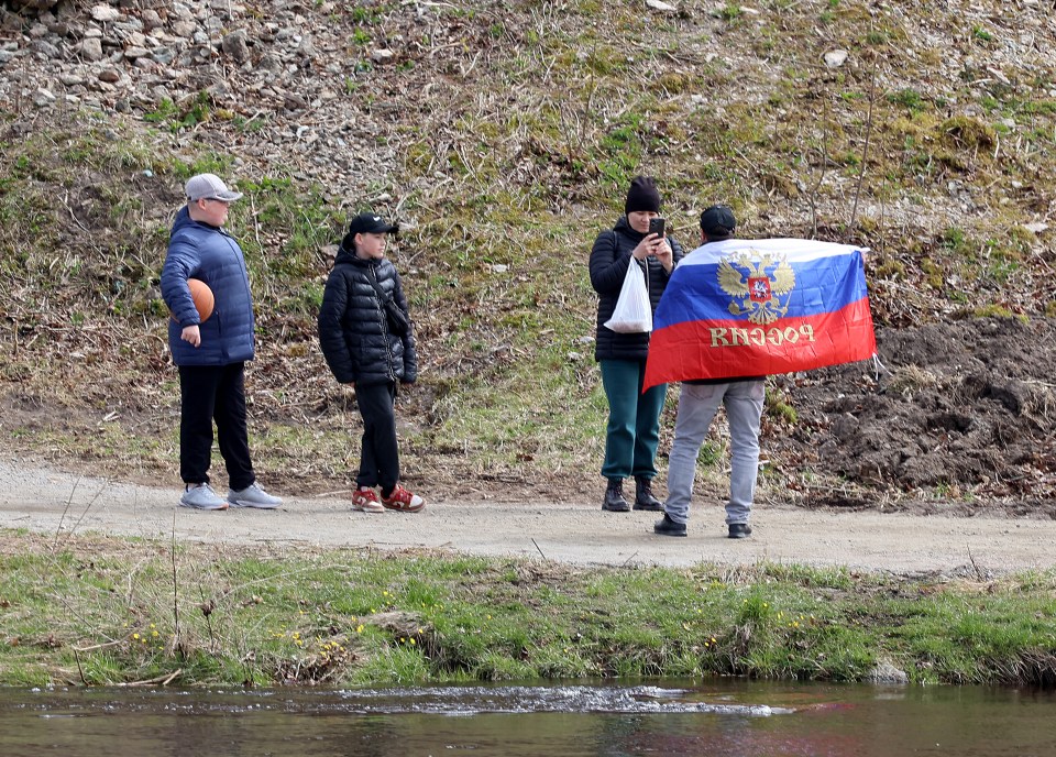 Meanwhile, across the river, Russians were holding up a Russian flag