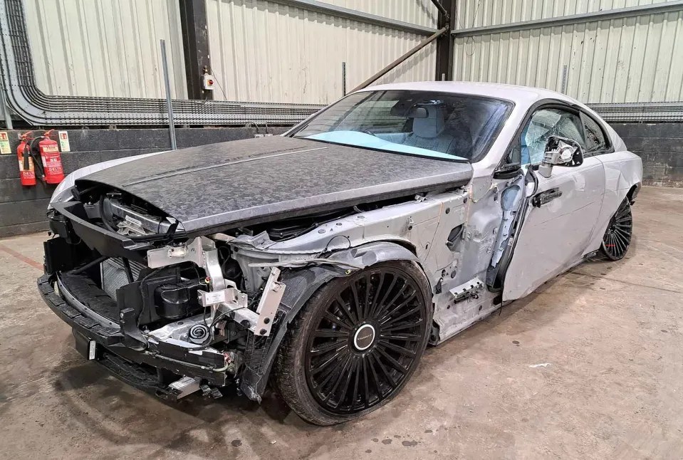 The old £700,000 V12 Rolls Royce Wraith hit a pole on a traffic island