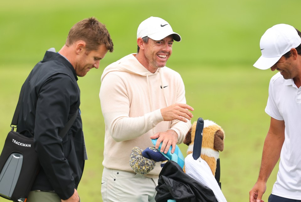 Rory McIlroy laughed and joked around on the golf course yesterday, just hours after his divorce was confirmed