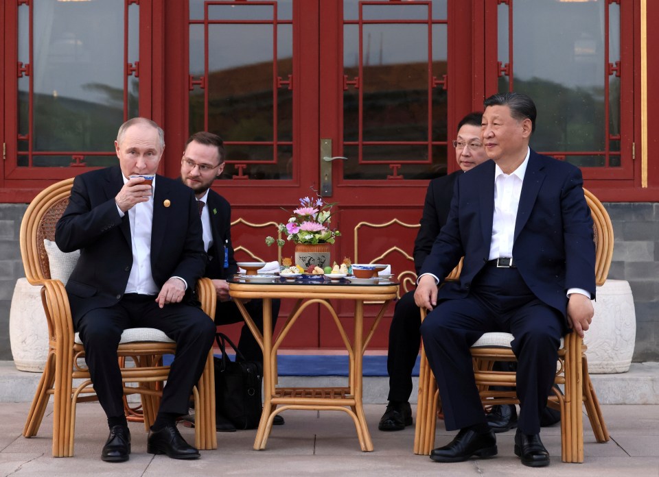 Putin and Xi share tea and snacks as the sun sets