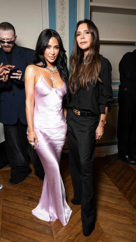 Cameras captured Victoria as she welcomed Kim to her fashion show