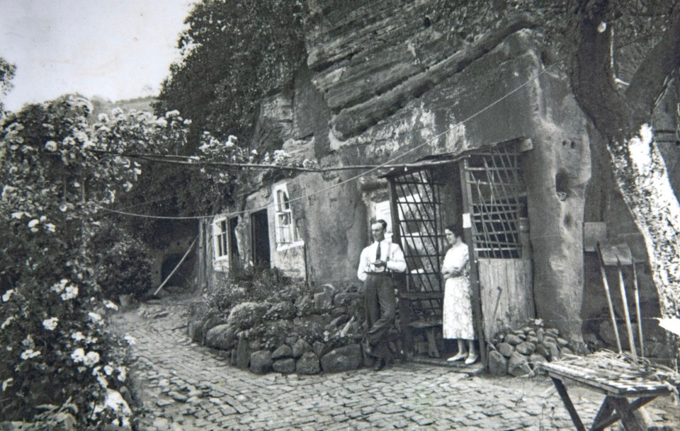 Stuart's grandparents outside their rock house in the 1930s