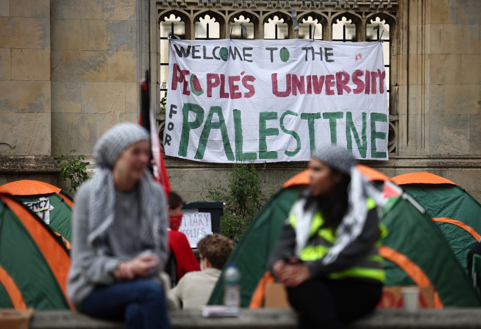 A pro-Palestine banner hangs on a wall of King's College Cambridge