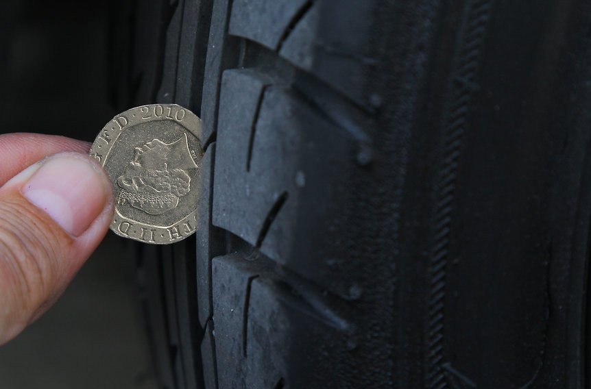 Using a 20p coin to check your tyre tread depth can save you valuable pennies