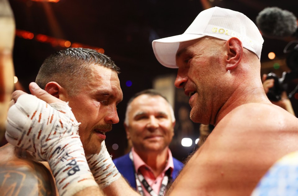 Oleksandr Usyk and Tyson Fury embrace after their epic fight