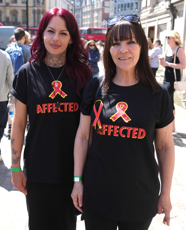 Two campaigners outside Central Hall in Westminster after the report was published