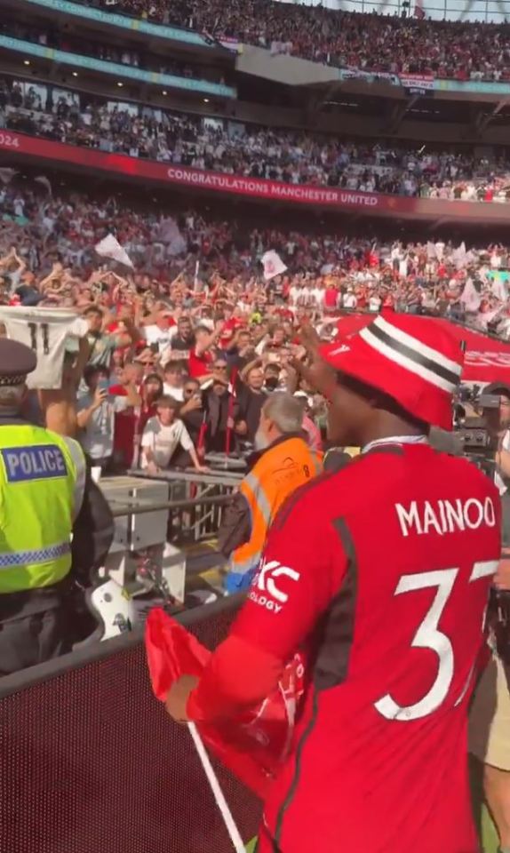 The Red Devils supporter duly obliged and tossed Mainoo the cool cap