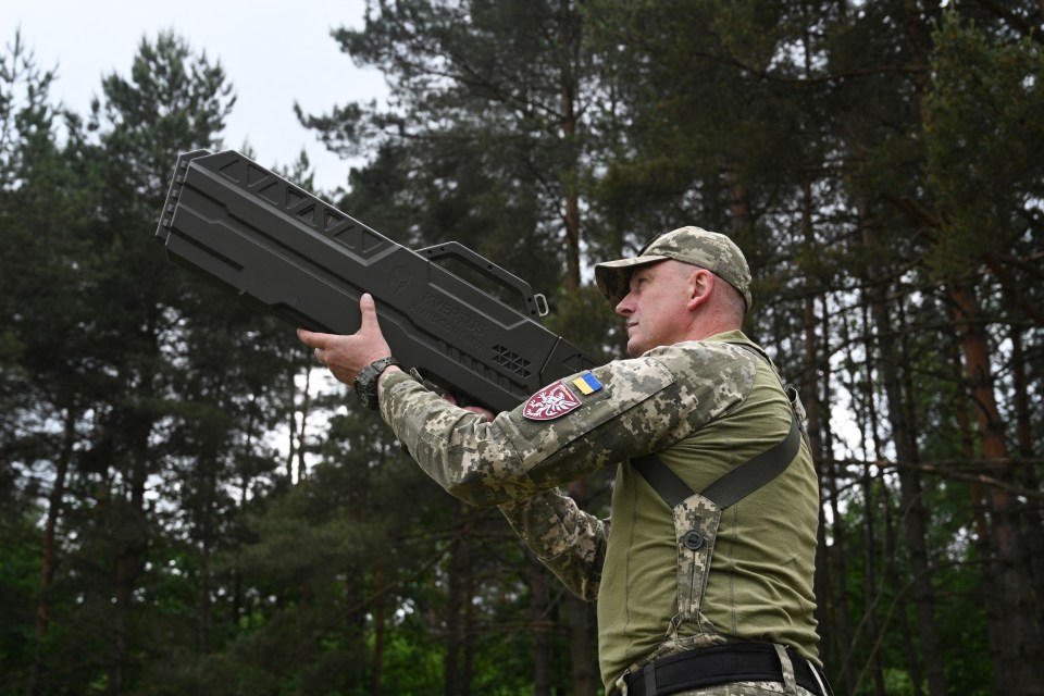 A Ukrainian serviceman testing the anti-drone gun