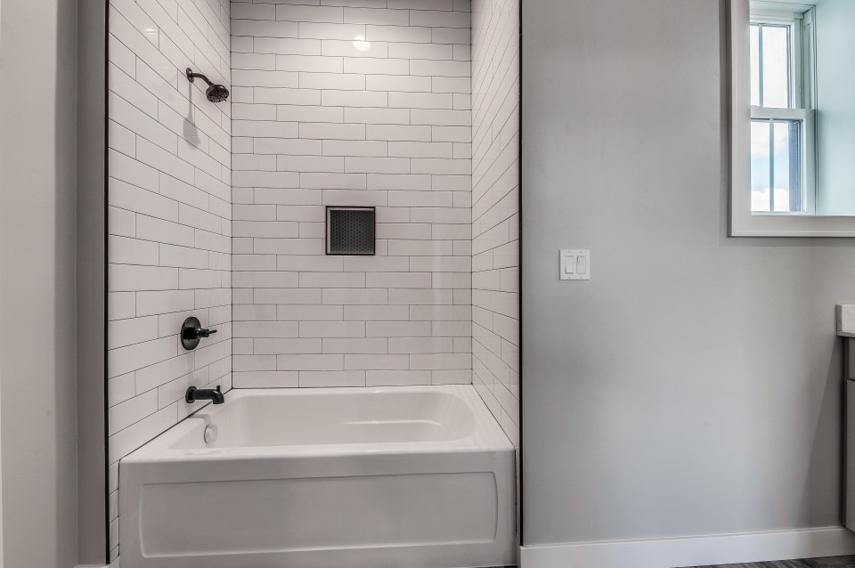 She claimed that white tiles with grout will make your bathroom look like a public loo